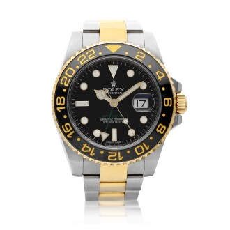View 1 of Lot 8246: GMT-Master II, Reference 116713LN | A yellow gold and stainless steel dual time zone wristwatch with date and bracelet, Circa 2011 | 勞力士 GMT-Master II 型號116713LN | 黃金及精鋼兩地時間鏈帶腕錶，備日期顯示，約2011年製
