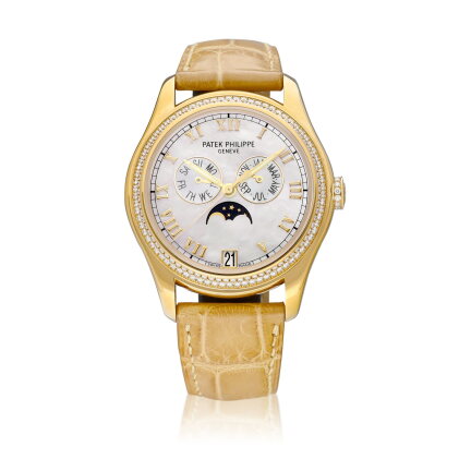 Catalog image of Reference 4936 | A yellow gold and diamond-set annual calendar wristwatch with …