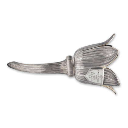 Catalog image of an unusual victorian parcel-gilt silver lotus-form wine strainer, 19th century