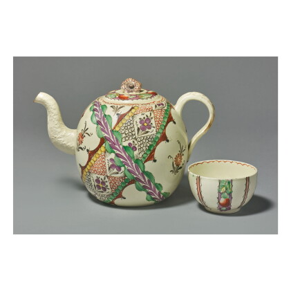 Catalog image of an english creamware 'chintz' pattern teapot and a cover and a teabowl, probabl…