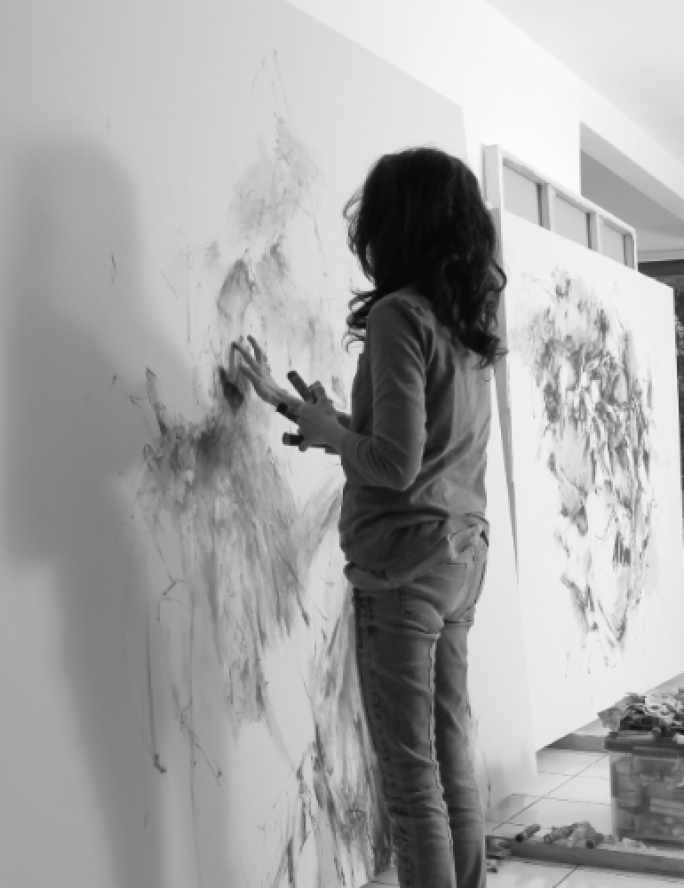 Photograph of the Christine Ay Tjoe in her studio, Courtesy of David Maru