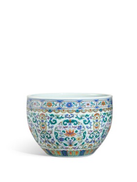 View 1 of Lot 1116: A fine doucai and famille-rose 'floral' jardinière, Seal mark and period of Qianlong  | 清乾隆　鬪彩加粉彩捲草團花紋缸　《大清乾隆年製》款