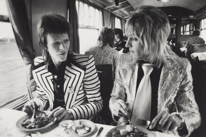 Catalog image of mick rock | david bowie and mick ronson, lunch on train to aberdeen, scotland, 1973
