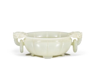 View 1 of Lot 24: A white jade 'dragon' washer, Qing dynasty, Qianlong period |  清乾隆 白玉龍首活環洗
