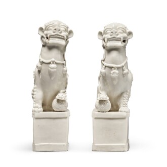 View 1 of Lot 639: A pair of 'Dehua' 'Buddhist lion' joss stick holders, Qing dynasty, 18th century | 清十八世紀 德化白釉佛獅香插一對