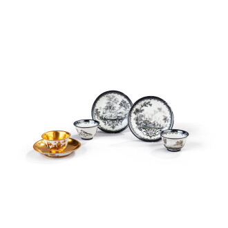 View 1 of Lot 609: A pair of Meissen Hausmaler silvered Schwarzlot teabowls and saucers, the porcelain early 1720s, the decoration circa 1730, and a Hausmaler gilt chinoiserie teabowl and saucer, circa 1725