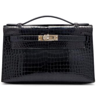 View 1 of Lot 1210: Black Porosus Crocodile Kelly Pochette Palladium Hardware, 2005