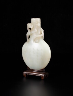 View 1 of Lot 9: An imperial inscribed white jade bottle 'dragon' vase Qing dynasty, Yuzhi mark and period of Qianlong | 清乾隆 白玉鏤雕螭龍紋瓶