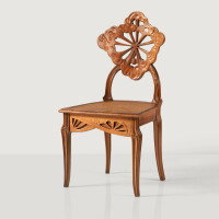 Émile Gallé, La Berce des Prés or Ombelles chair, circa 1902. Carved walnut and cane, Signed Gallé on one leg. Estimate €8,000-12,000.
