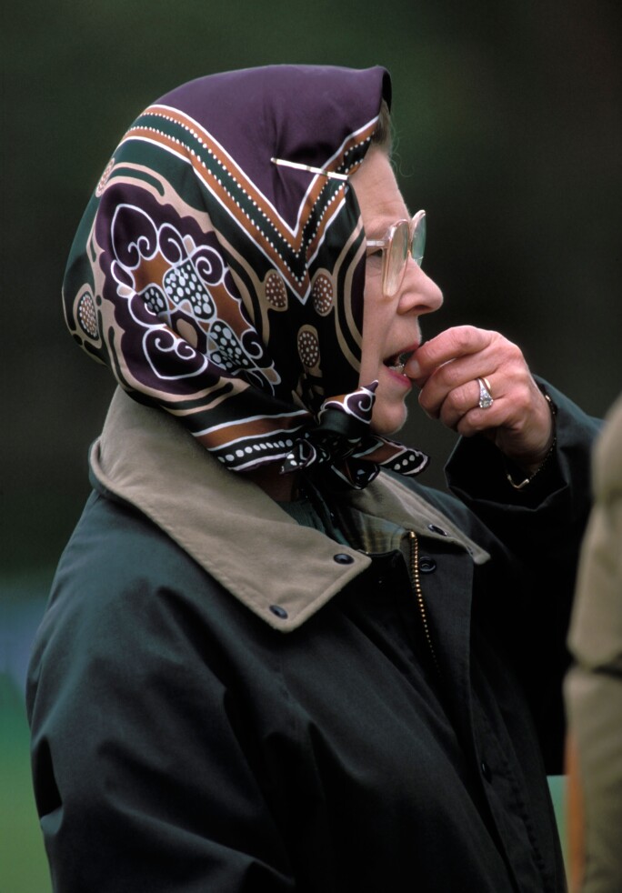 A worried looking HM Queen Elizabeth II biting her nails watching the Windsor Show Circa 1989. Image shot 1989. Exact date unknown.