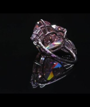 A Magnificent Fancy Intense Orangy Pink Diamond Ring