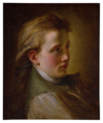 Catalog image of Young man wearing a green coat