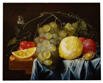 View 1 of Lot 33: Still life of fruit, including lemons, grapes, pears and cherries, together with a hazelnut, all arranged on a table largely draped with a blue cloth | 《靜物：桌子上的檸檬、葡萄、紅梨、櫻桃及一顆榛子，藍色布覆蓋大半桌面》