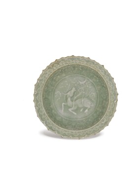 View 1 of Lot 5081: A Longquan celadon 'buffalo' dish 14th century 十四世紀 龍泉窯青釉牛紋盤