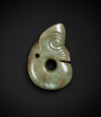 View 1 of Lot 83: An important celadon and russet jade 'pig-dragon', zhulong Neolithic period, Hongshan culture | 新石器時代 紅山文化青白玉豬龍