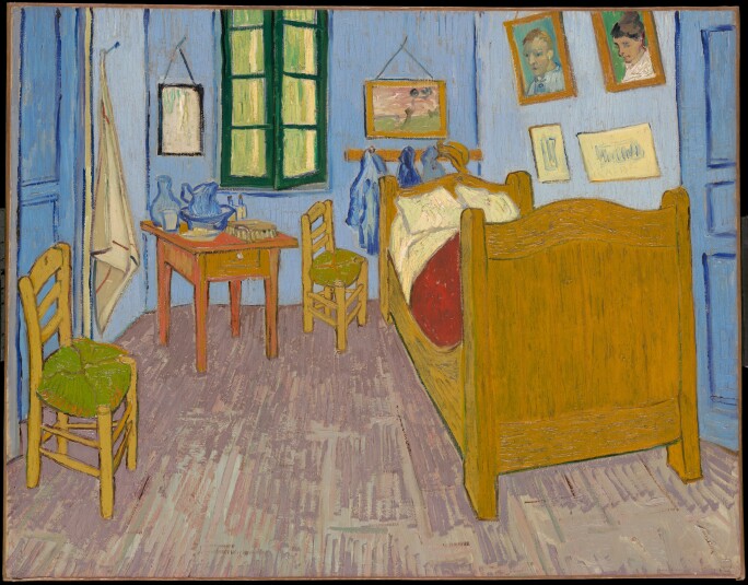 Van Gogh's colorful painting of his bedroom at Arles, with a twin bed, two chairs, a side table and paintings hanging on the walls.