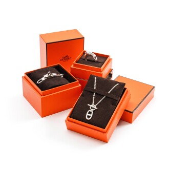 View 1 of Lot 394: Set of Three: Silver Double Kelly Chaine Bracelet, Pedentif Chaine d'ancre and Bague Galop