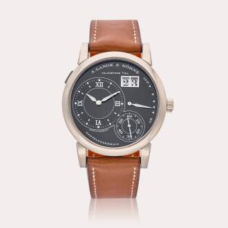 View 1 of Lot 699: Reference 101.029 Lange 1 Luminous | A white gold wristwatch with digital date display and power reserve indication, Circa 2005