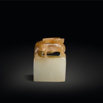 View 1 of Lot 599: A celadon and brown jade 'chilong' seal, Qing dynasty | 清 玉雕螭龍鈕印