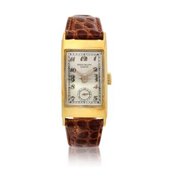 View 1 of Lot 147: Reference 425 Tegolino  A yellow gold rectangular wristwatch, Circa 1940