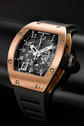 Catalog image of rm010 a pink gold curved tonneau semi-skeletonized automatic center seconds wri…