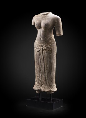 View 1 of Lot 236: A grey sandstone torso of a female divinity Khmer art, Baphuon style, circa 11th Century | 高棉藝術 約十一世紀 巴普昂式砂岩雕女神立像殘件