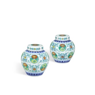 View 1 of Lot 143: A fine and very rare pair of doucai 'lotus and chrysanthemum' jars and covers, Seal marks and period of Qianlong | 清乾隆 鬪彩番蓮團菊紋蓋罐一對 《大清乾隆年製》款