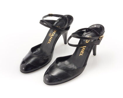 Catalog image of pair of black leather and patent leather sandals
