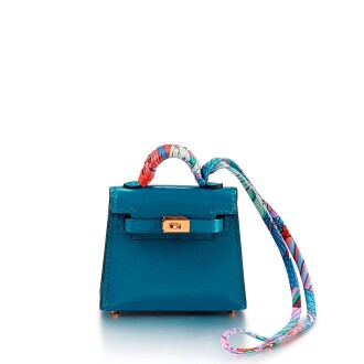 View 1 of Lot 1103: Bleu Izmir Tadelakt Kelly Twilly Bag Charm Gold Hardware, 2021  