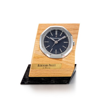Catalog image of Royal Oak Offshore, A stainless steel alarm desk clock with wooden stand, Circa…