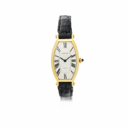 Catalog image of cartier, paris | tonneau a yellow gold wristwatch, circa 1990