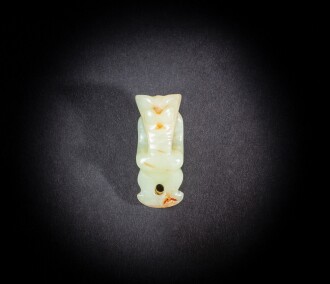 View 1 of Lot 76: A yellow and russet jade ‘humanoid figure’ pendant, Neolithic period, Hongshan culture | 新石器時代 紅山文化 玉雕神人