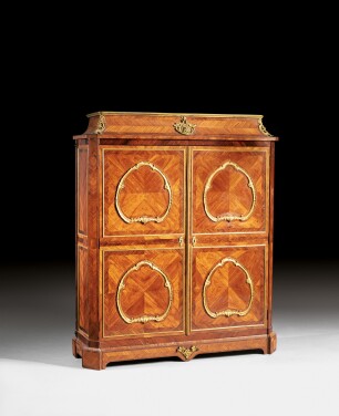 View 1 of Lot 139: A gilt-bronze mounted tulipwood and kingwood cupboard in the manner of BVRB, late Louis XV, circa 1760-1770 | Armoire en placage de bois de rose et bois de violette, monture de bronze doré de la fin de l'époque Louis XV, vers 1760-1770, dans le goût de BVRB