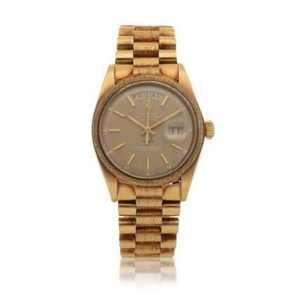 Catalog image of 'Qaboos' Day-Date, Ref. 1811 Yellow gold wristwatch with textured bezel and cen…