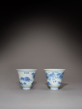 View 1 of Lot 91: A rare pair of hall marked blue and white 'landscape' cups, Marks and period of Daoguang | 清道光 青花人物山水圖盃一對 《大清道光年製》《樂古堂》款