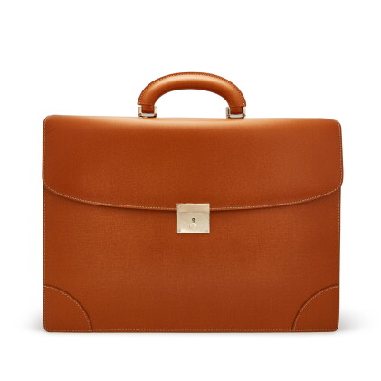 Catalog image of Valextra: A brown leather briefcase with gold plated hardware