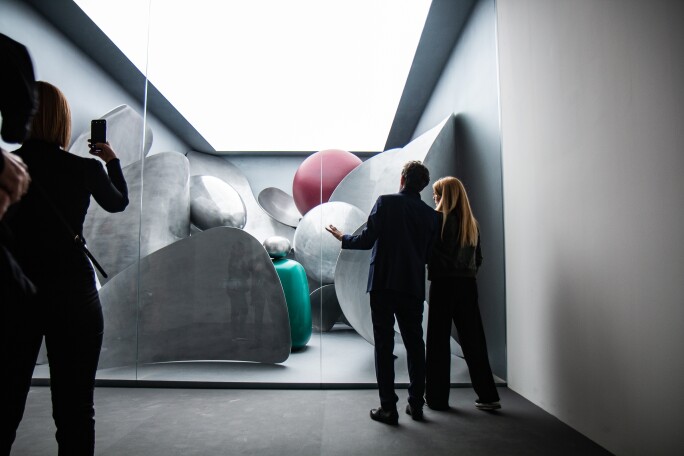 People looking at an art installation at the Venice Biennale.