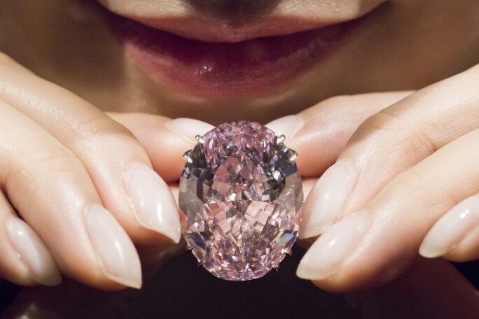 A model displays The CTF Pink Star, a 59.60-carat oval mixed-cut pink diamond. Photo by studioEAST/Getty Images.