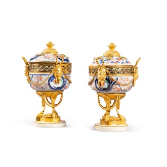 View 1 of Lot 574: A pair of gilt-bronze mounted Japanese Imari porcelain pot-pourri vases, the porcelain probably late 17th century, the mounts Louis XVI, circa 1780