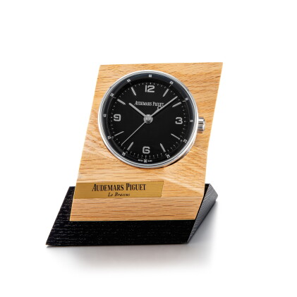 Catalog image of Code 11.59, A stainless steel alarm desk clock with wooden stand, Circa 2019 | …