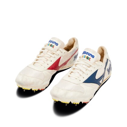 View 1 of Lot 11: Florence Griffith Joyner 'World Record Setting and Gold Medal Winning' 200m Signed and Inscribed Spikes | 1988 Olympic Games | 21.34 Seconds