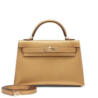 View 1 of Lot 5: Limited Edition Dore Chèvre Chamkilight Metallic Mini Kelly II 20 Permabrass Hardware, 2024