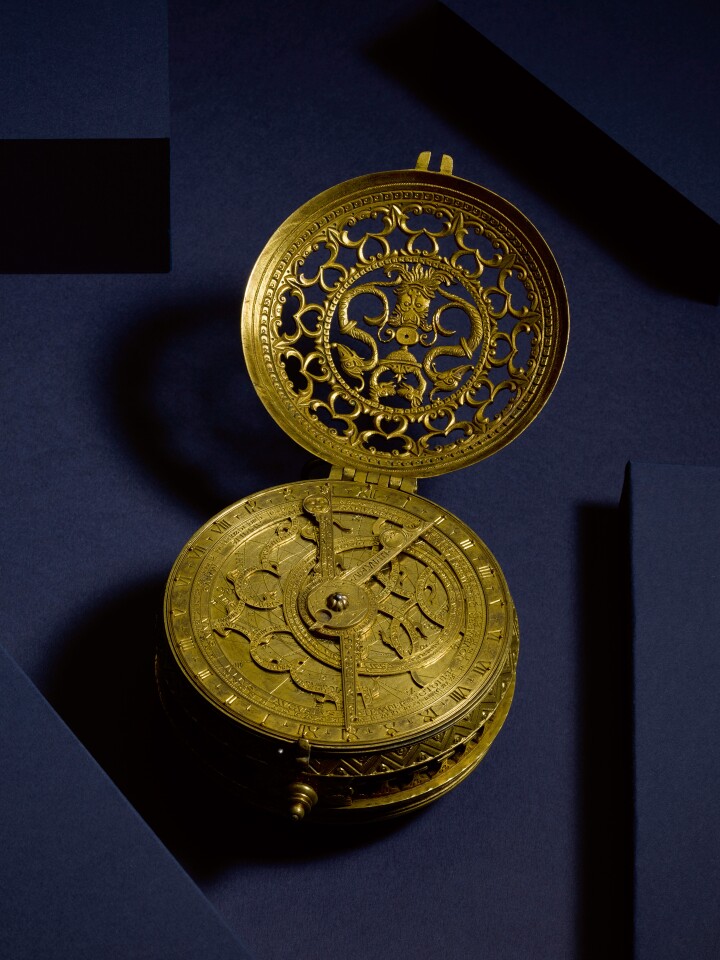 German, Stamped CK, An Important and Massive Early Gilt-Brass Hour Striking Clock Watch with Stackfreed, Alarm and Astrolabic Dial, circa 1575.