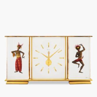 View 1 of Lot 8873: "Marina" | A gilt brass desk clock with motif of two Indonesian dancers, Circa 1960