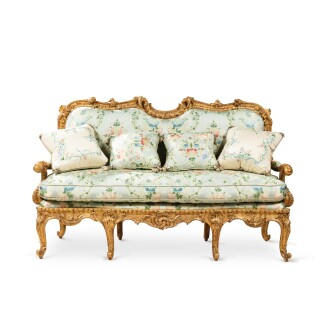 View 1 of Lot 592: A carved giltwood canapé à chassis attributed to Nicolas Heurtaut (1720-1771), Louis XV, Circa 1755