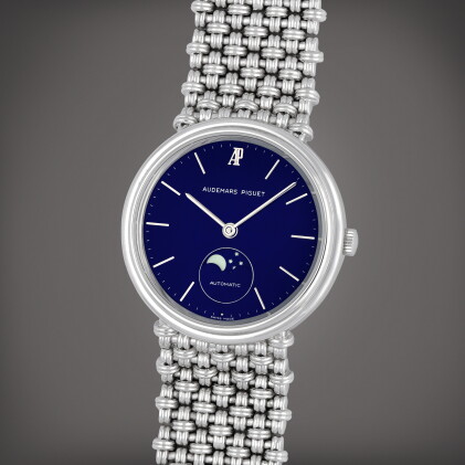 Catalog image of A white gold bracelet watch with moon phases and integrated bracelet | Circa 1985