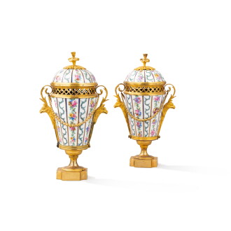 View 1 of Lot 186: A pair of Louis XVI gilt-bronze mounted Sèvres pot-pourri vases with covers, circa 1780 | Paire de vases couverts pots pourri en porcelaine de Sèvres et bronze doré d'époque Louis XVI, vers 1780