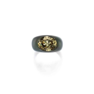 View 1 of Lot 201: Aluminum and Fancy Deep Brownish Greenish Yellow Diamond Ring