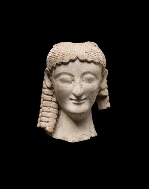 View 1 of Lot 150: A Greek Terracotta Head of a Goddess, Magna Graecia circa late 6th/early 5th Century B.C