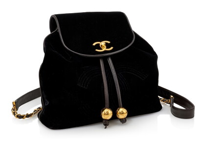 Catalog image of black velvet and leather with gold-tone metal backpack